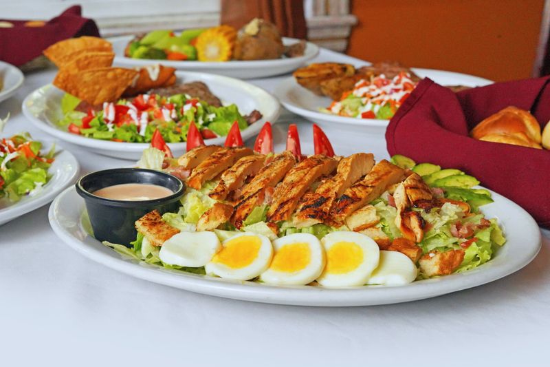 Grilled Chicken Salad with avocado and mixed greens at Marcos