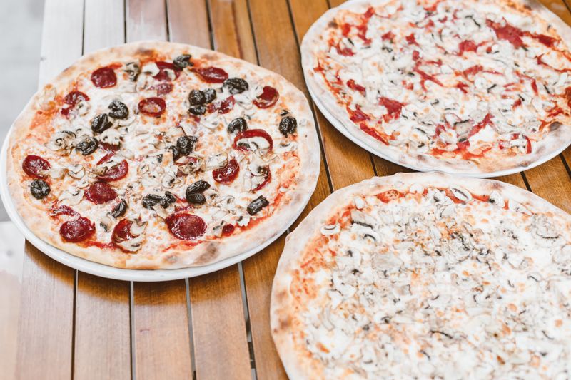 Marco's Classic Margherita Pizza with fresh basil and mozzarella